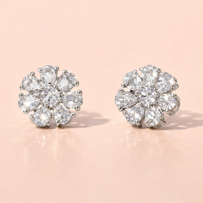Pair of diamond AD Earrings for Women on a light pink background