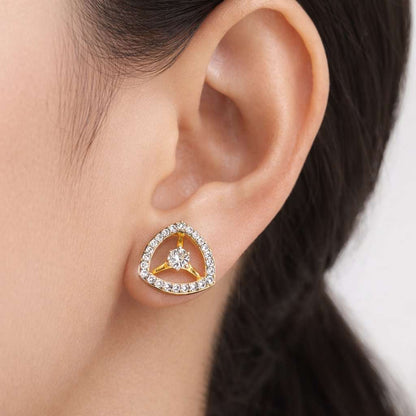 Gold and diamond AD Earrings for Women worn on a person's ear with a neutral background