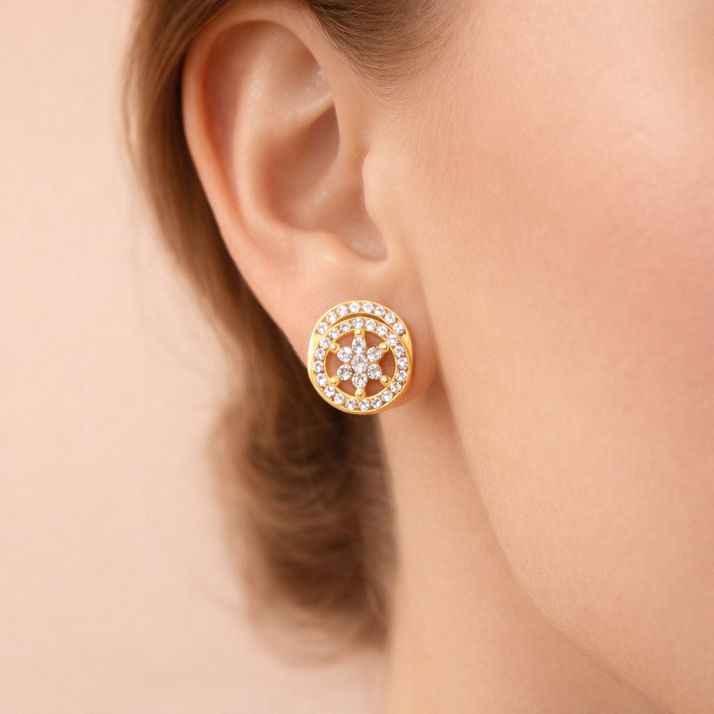 Gold AD Earrings for Women with star design worn on an ear against a neutral background