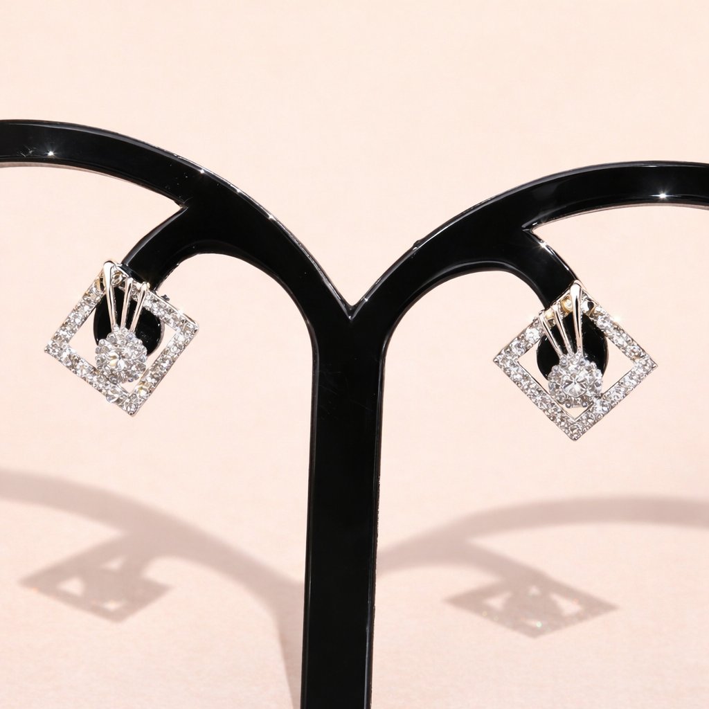 Diamond AD Earrings for Women on a black stand against a light pink background