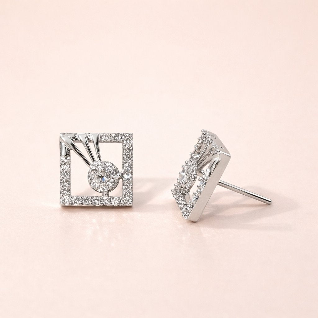 Pair of diamond AD Earrings for Women on a light pink background