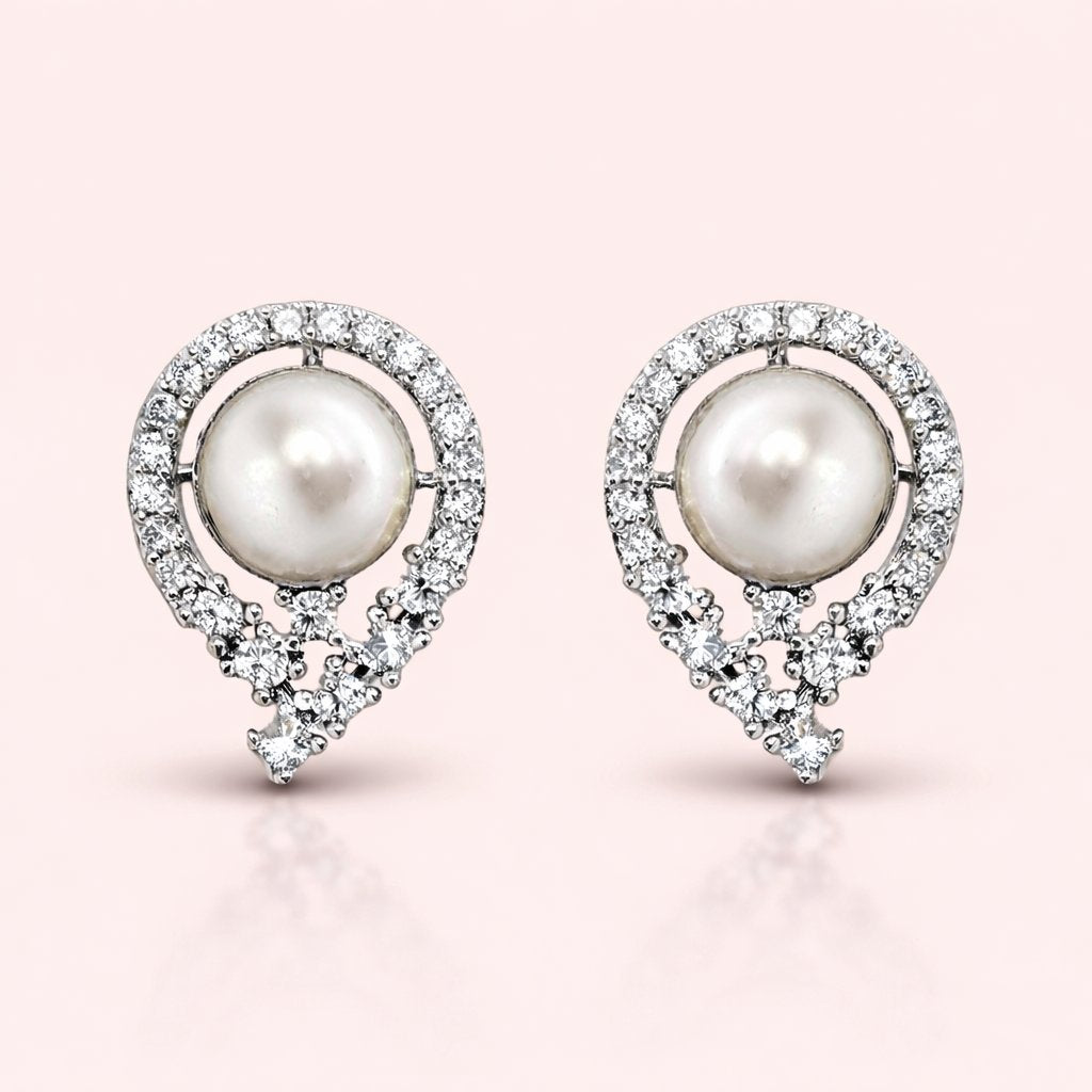 Pearl AD Earrings for Women with diamond accents on a pink background