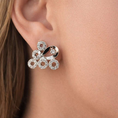 Silver AD Earrings for Women worn on a person's ear with a close-up view.