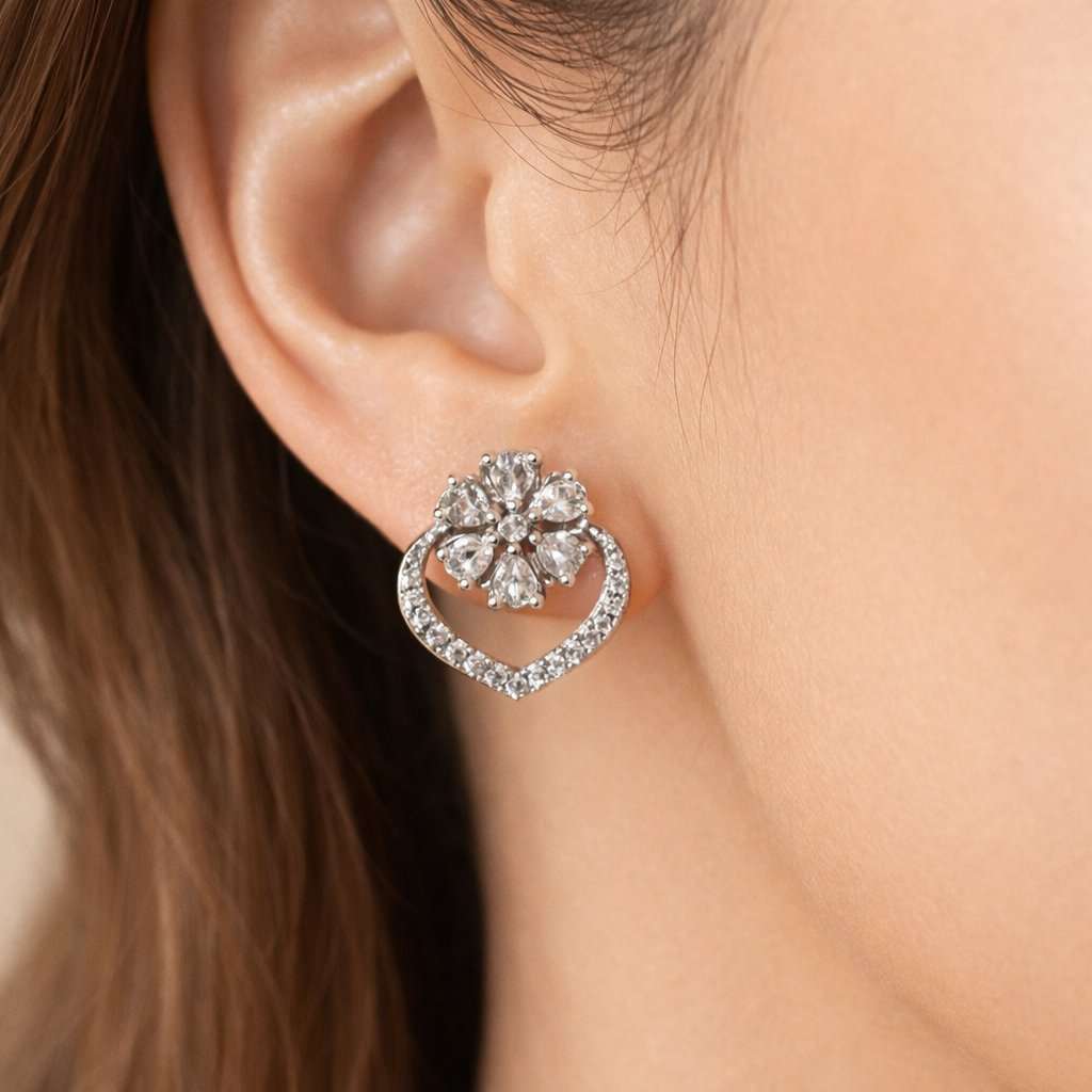 Pearl AD Earrings for Women with silver and crystal accents on a light pink background