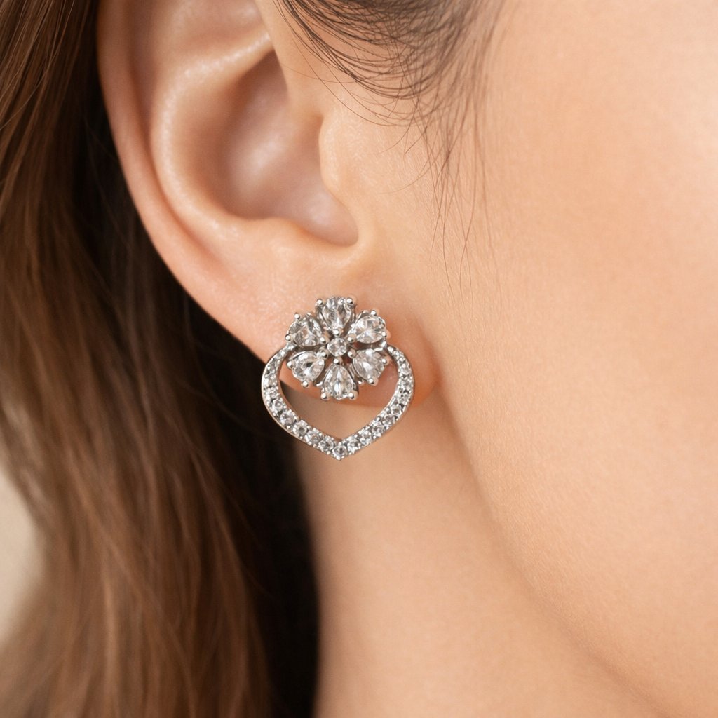 Pearl AD Earrings for Women with silver and crystal accents on a light pink background