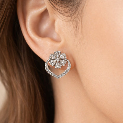 Pearl AD Earrings for Women with silver and crystal accents on a light pink background