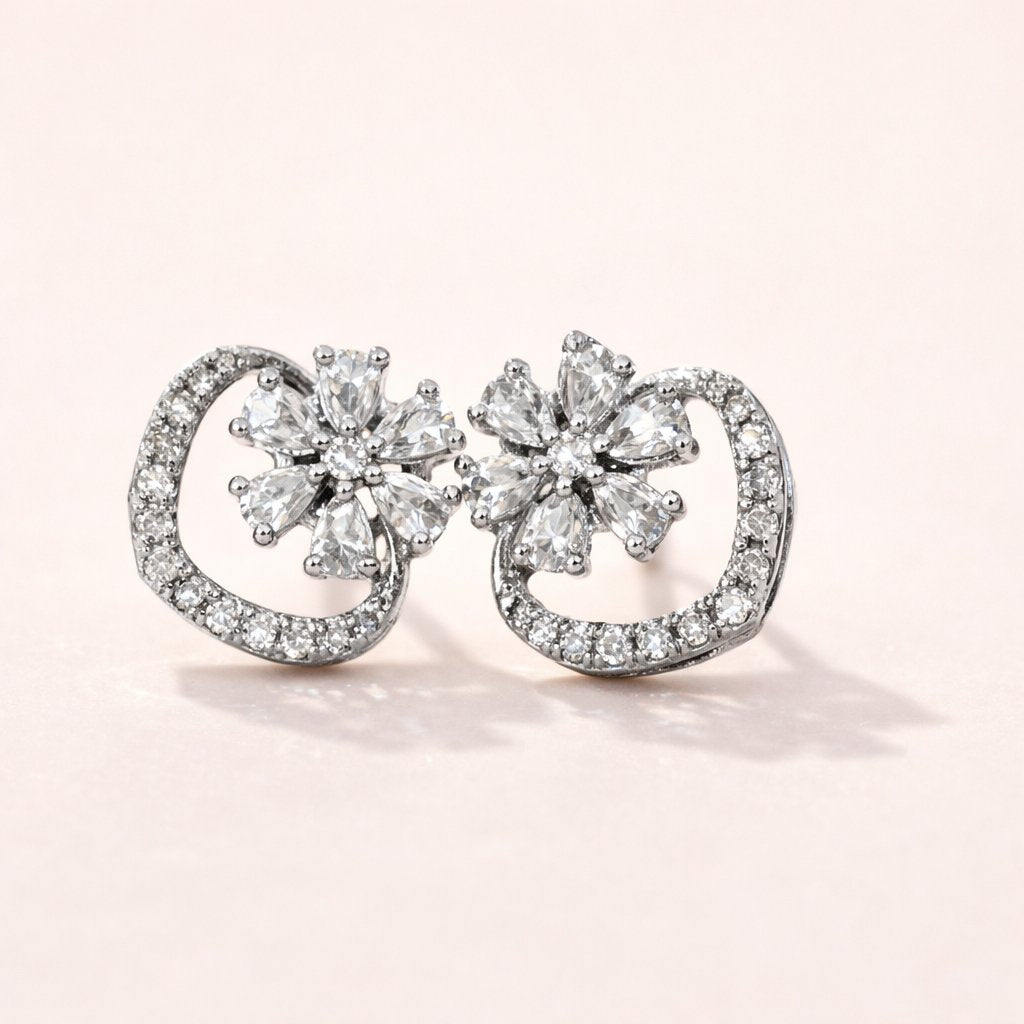 Pair of diamond AD Earrings for Women on a light pink background
