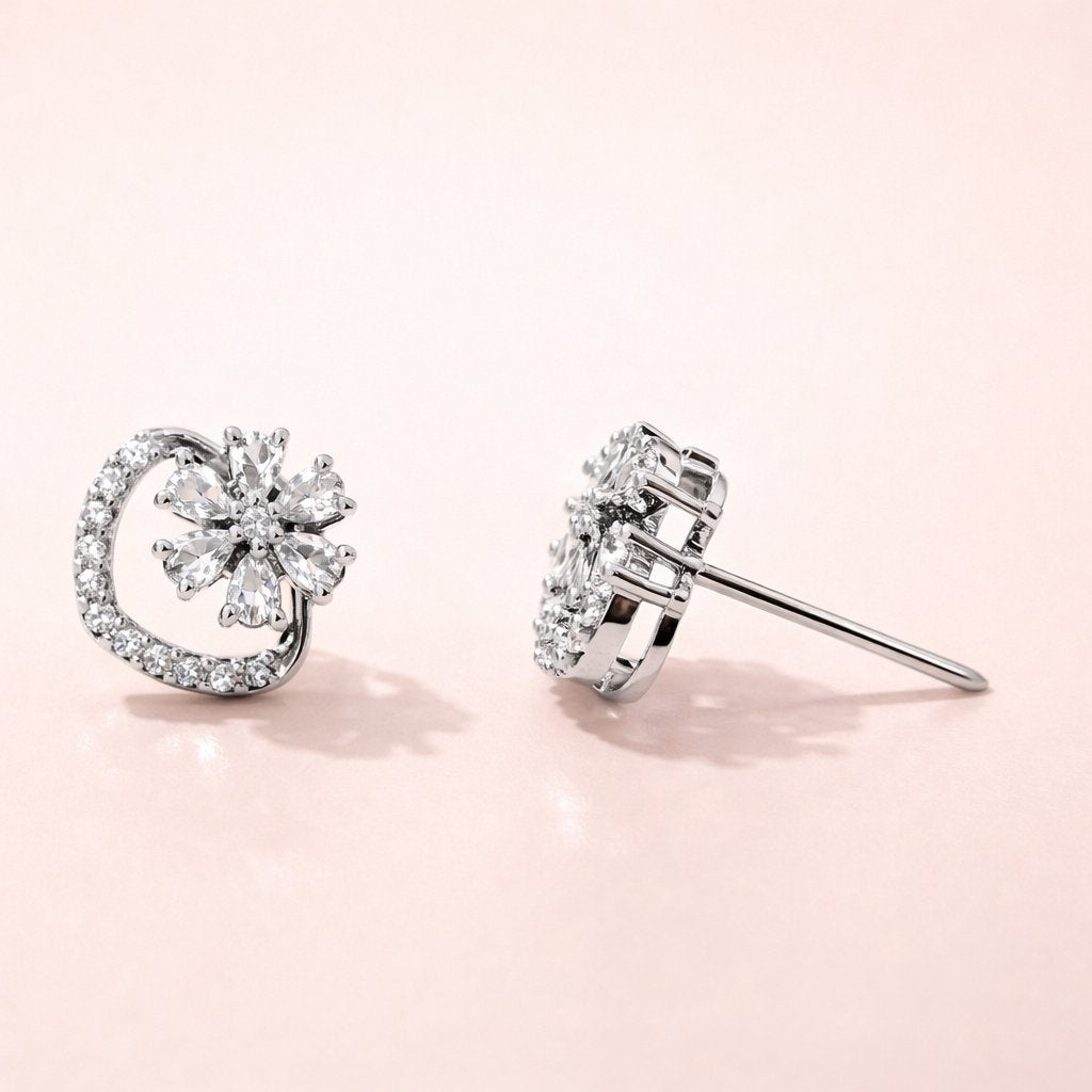 Pair of diamond AD Earrings for Women on a light pink background