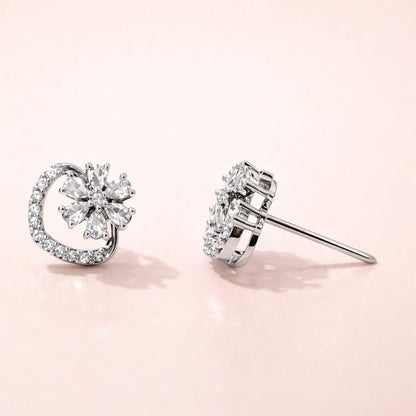 Pair of diamond AD Earrings for Women on a light pink background
