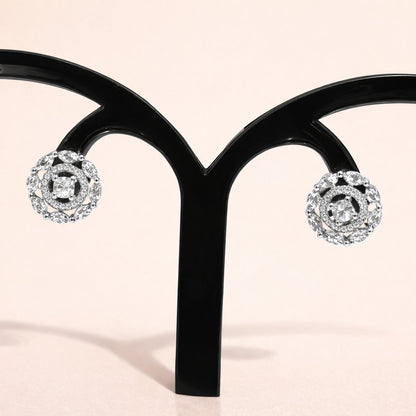 Diamond AD Earrings for Women on a black earring stand against a light pink background