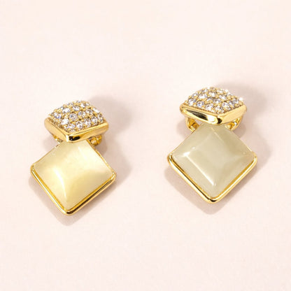 Gold AD Earrings for Women with square designs on a light background