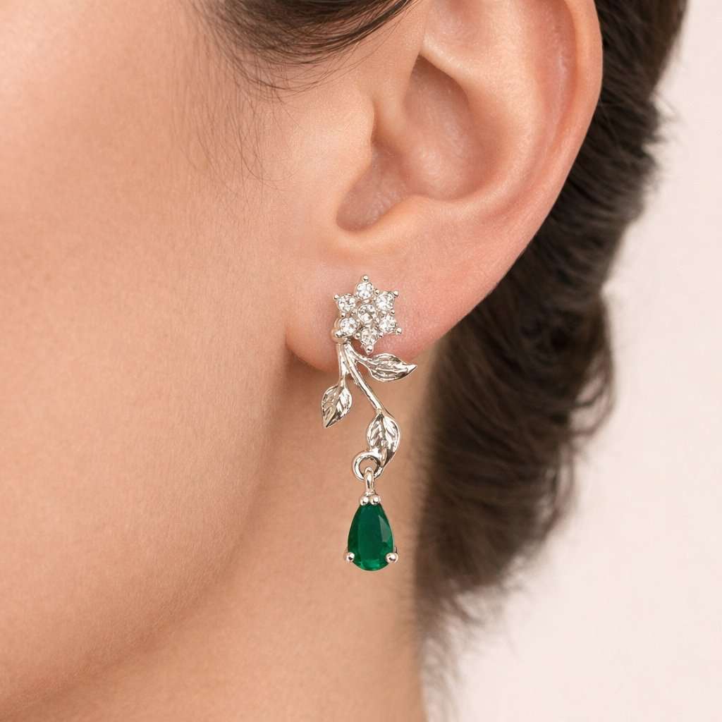 Silver AD Earrings for Women with green gemstone worn by a person