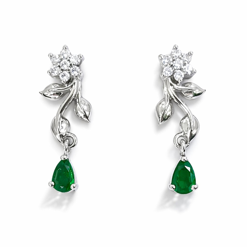 Pair of silver AD Earrings for Women with green gemstones on a white background