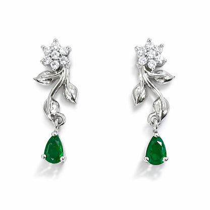 Pair of silver AD Earrings for Women with green gemstones on a white background