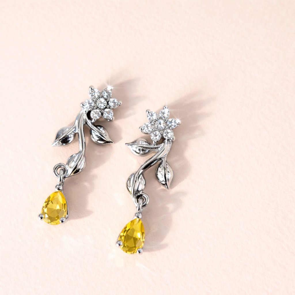 Silver AD Earrings for Women with yellow gemstones on a light pink background