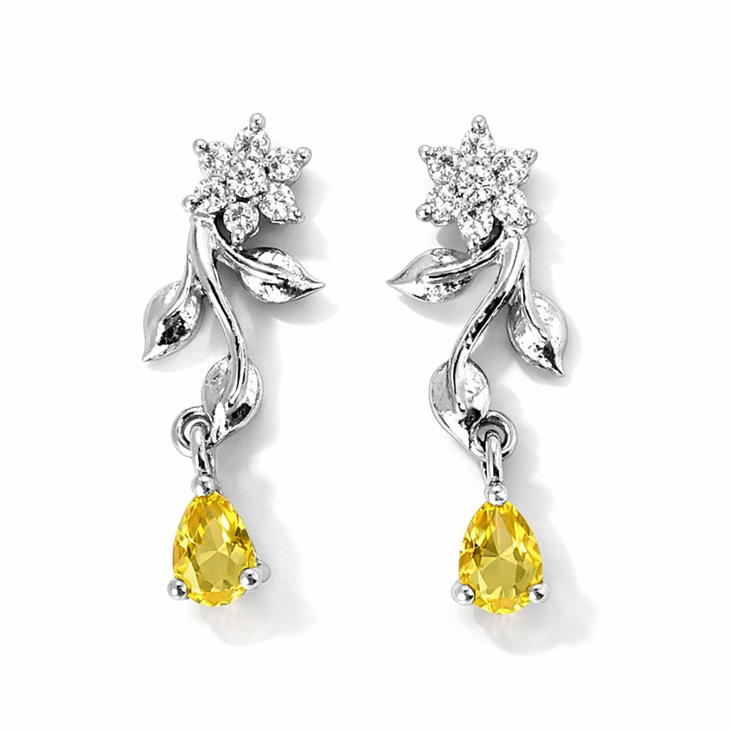 Silver AD Earrings for Women with yellow gemstones and floral designs on a white background