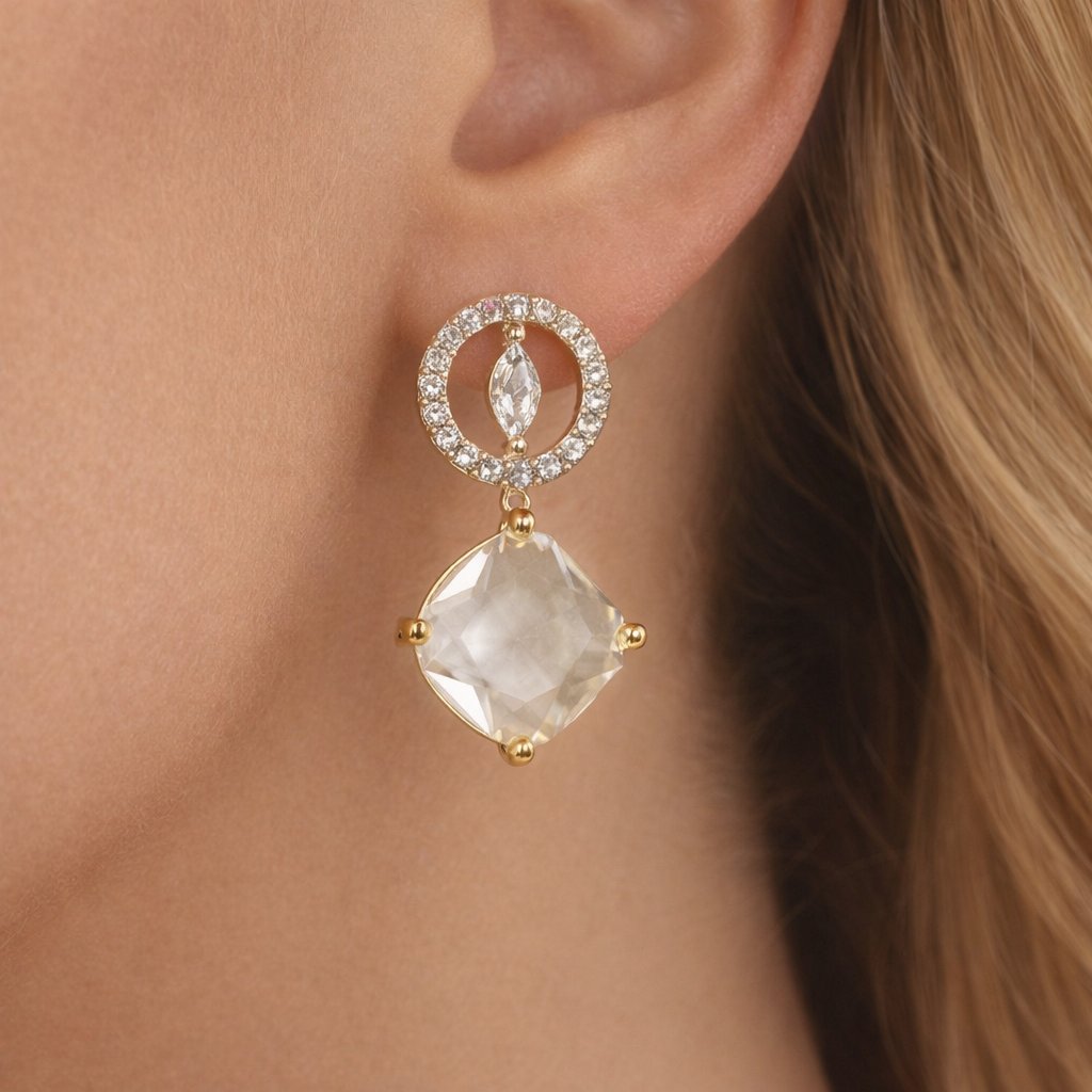 AD Earrings for Women with a clear gemstone and gold accents worn by a person with blonde hair.