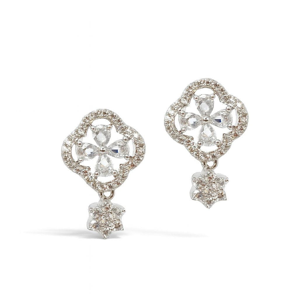 Heart-shaped AD Earrings for Women with clear gemstones on a white background