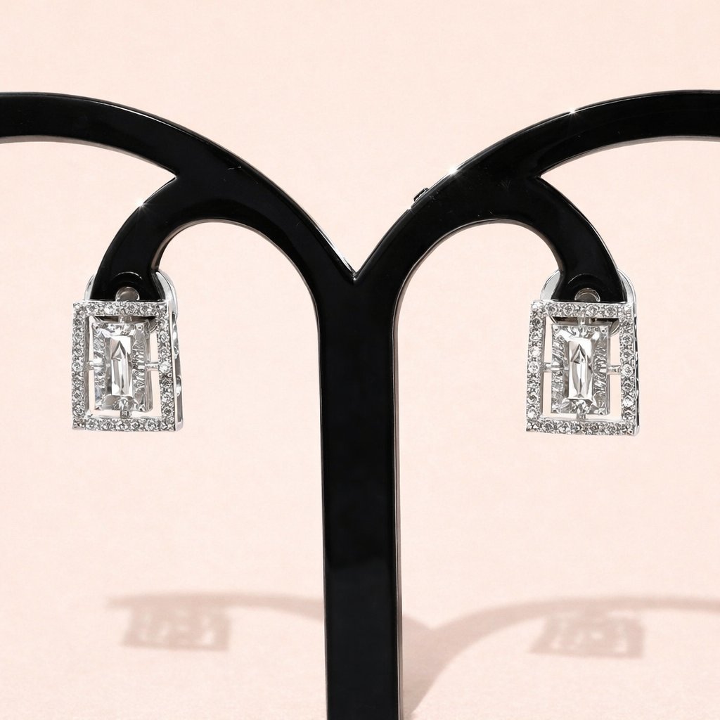 Diamond AD Earrings for Women on a black stand with a pink background