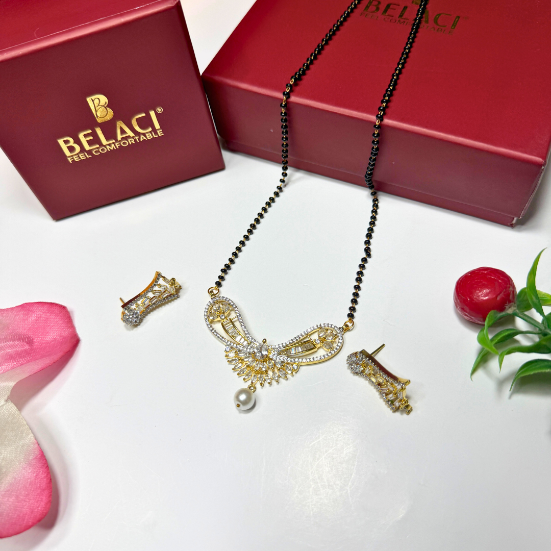 Gold AD Mangalsutra with black beads on a white surface with BELACI packaging.