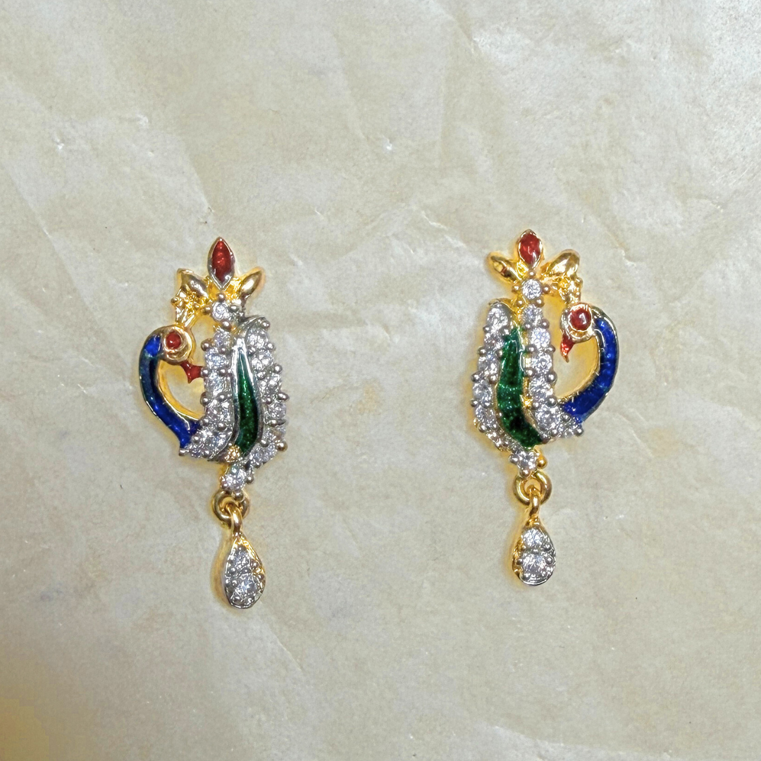 Pair of ornate Earrings for Women on a light marble background