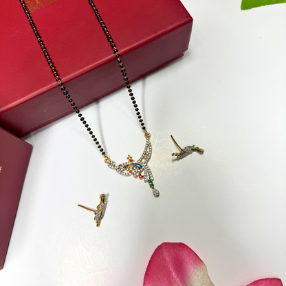 AD Mangalsutra Jewelry set with necklace and earrings on a white surface with a red box in the background.