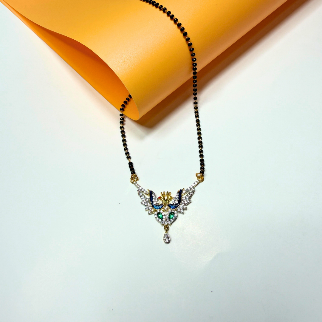 Jewelry AD Mangalsutra with black beads and a decorative pendant on a light background