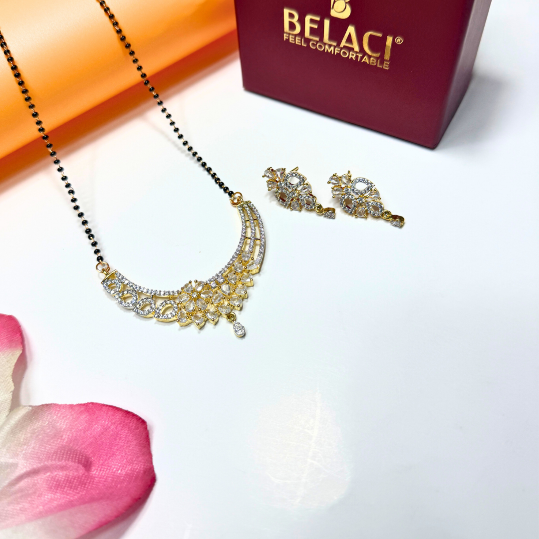 Gold AD Mangalsutra and earrings with a Belaci box on a white background