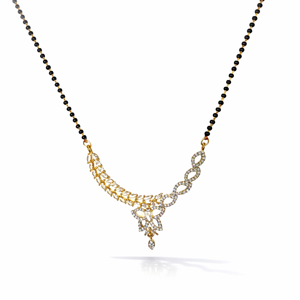 AD Mangalsutra with gold and black beads on a white background