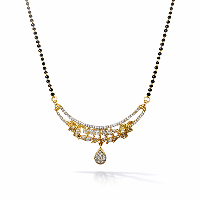 Gold and black beaded AD Mangalsutra with a decorative pendant on a white background