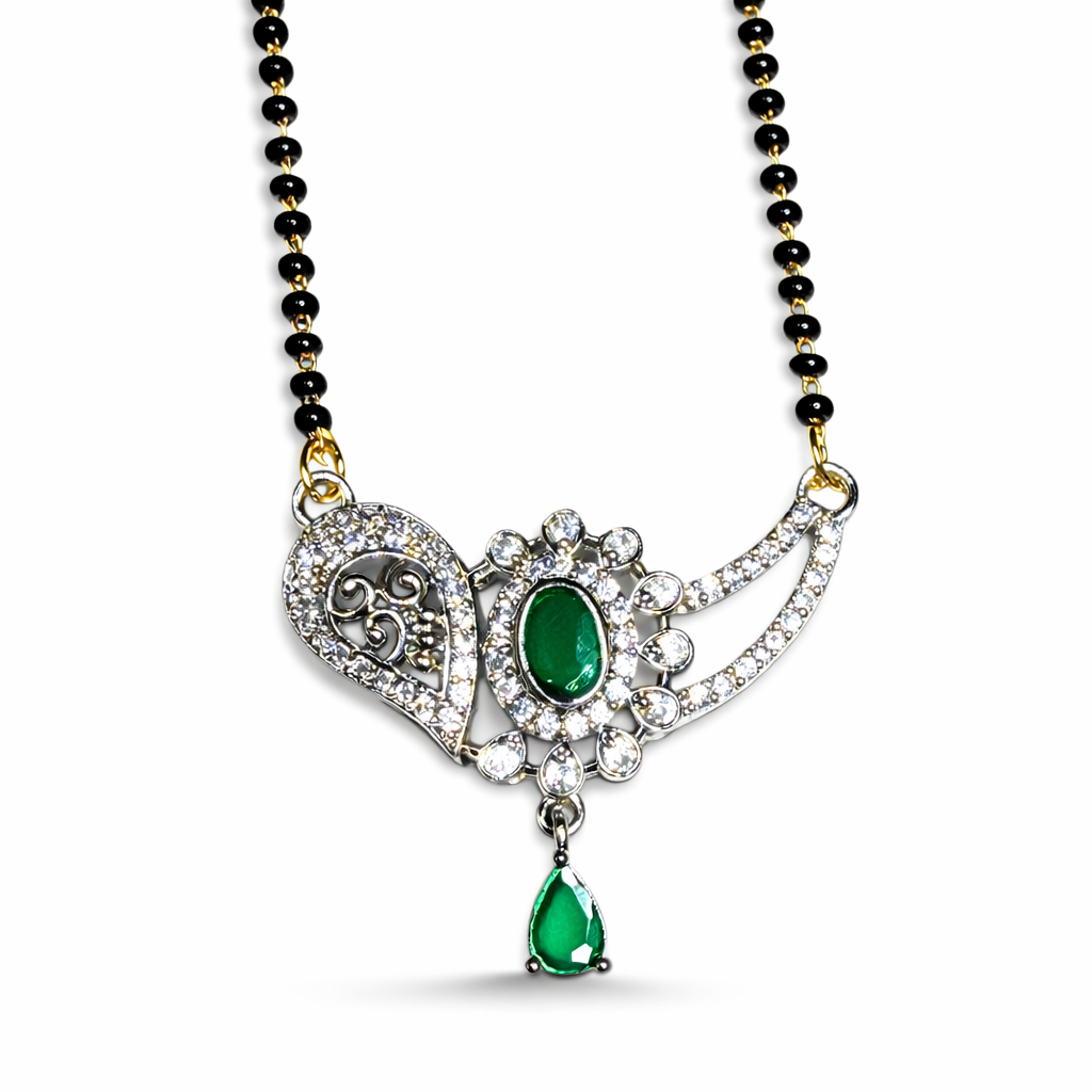 Designer AD Mangalsutra with green gemstone and black beads on a white background
