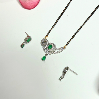 Mangalsutra Jewelry set with a necklace, earrings, and a ring on a white background
