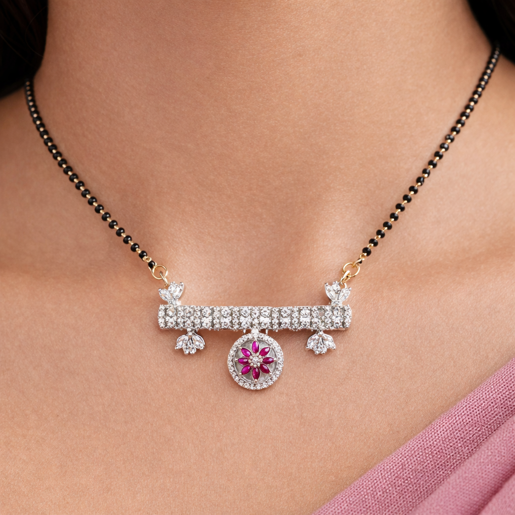 AD Mangalsutra with a pink gemstone pendant on a person's neck