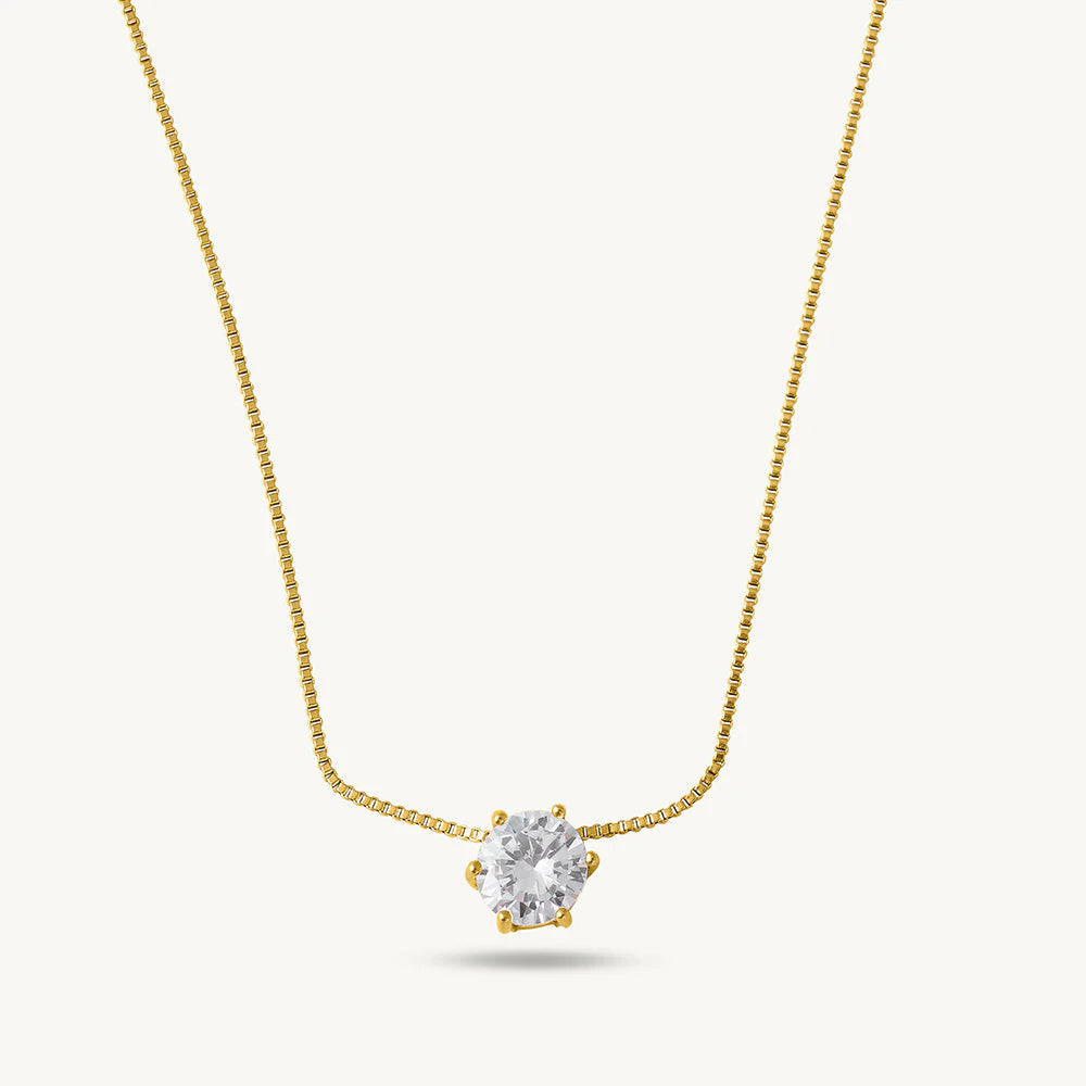 Gold Plated necklace with a heart-shaped diamond pendant on a light gray background