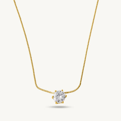 Gold Plated necklace with a heart-shaped diamond pendant on a light gray background