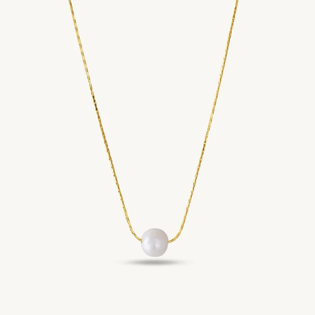 Gold necklace with a single pearl Pendant for Women on a white background