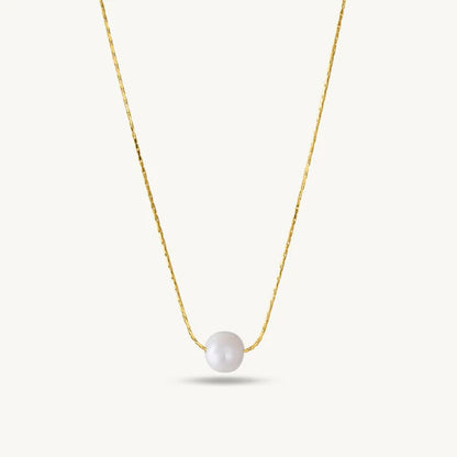 Gold necklace with a single pearl Pendant for Women on a white background