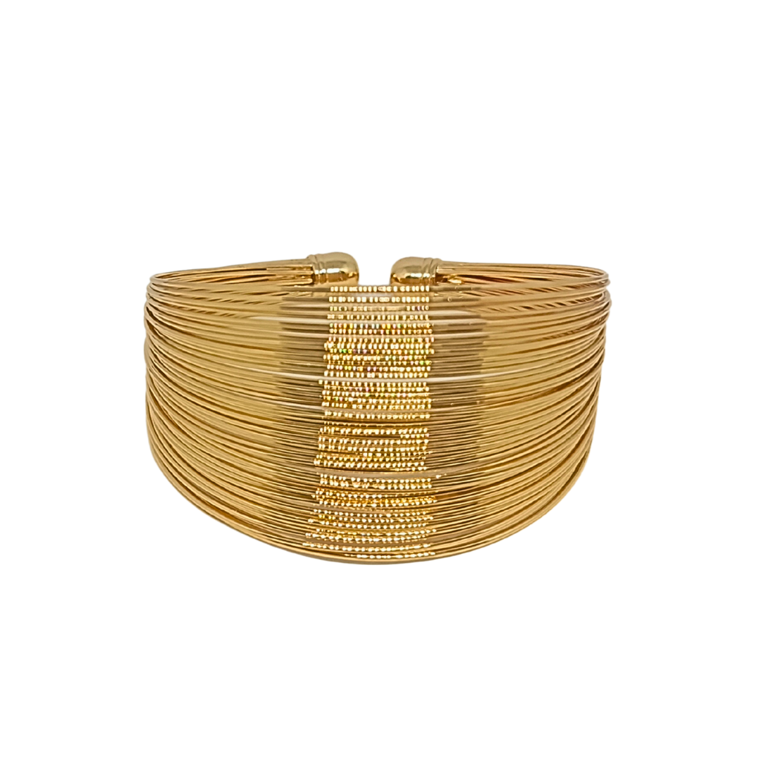 Gold bracelet on a white background