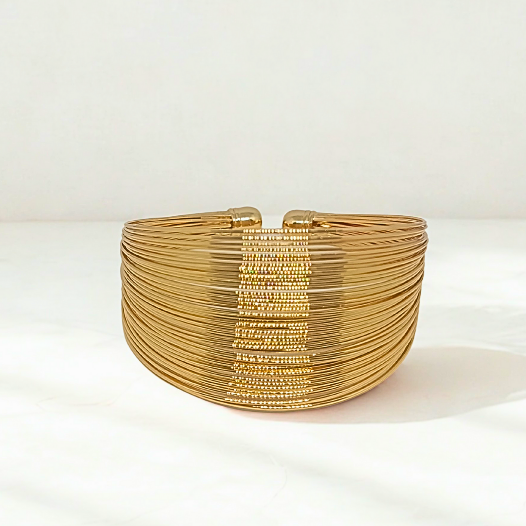 Gold Plated beaded bracelet on a white background