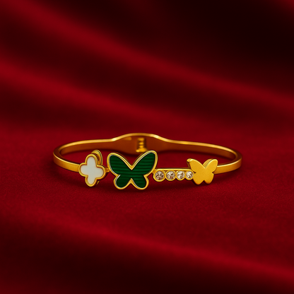 Gold Bracelet for Women with butterfly and flower designs on a red fabric background